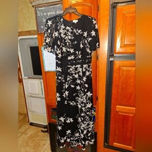 A Calvin Klein Floral Black and White lined maxi Dress in a size 12. Pre-loved